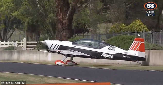 A plane delivering the Peter Brock Trophy for the Bathurst 1000 appeared to hit a wall as it landed on the track before the start of the race