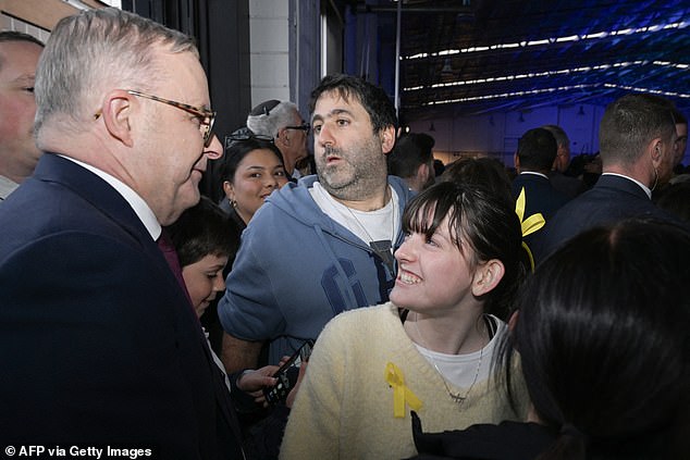 The Prime Minister received a warm welcome from some of those present at the vigil in Melbourne