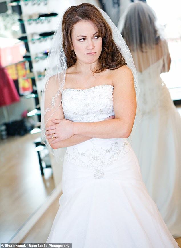 A wedding guest has been criticized for trying to outdo the bride after she bought a dress she knew was 'too bridal' (stock image)