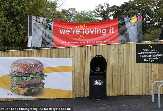 Rachel Laidler, 55, unfurled this cheeky 'we're not loving it' banner ten minutes before the grand opening of the new fast food store