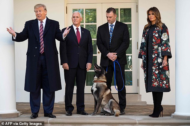 Melania Trump with President Donald Trump, Vice President Mike Pence, hero dog Conan and his handler at a November 2019 event in the White House Rose Garden