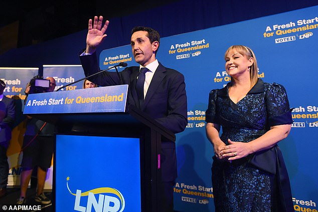 Queensland Premier-Elect and LNP Leader David Crisafulli (pictured left with wife Tegan) takes to the stage to claim victory in the Queensland election