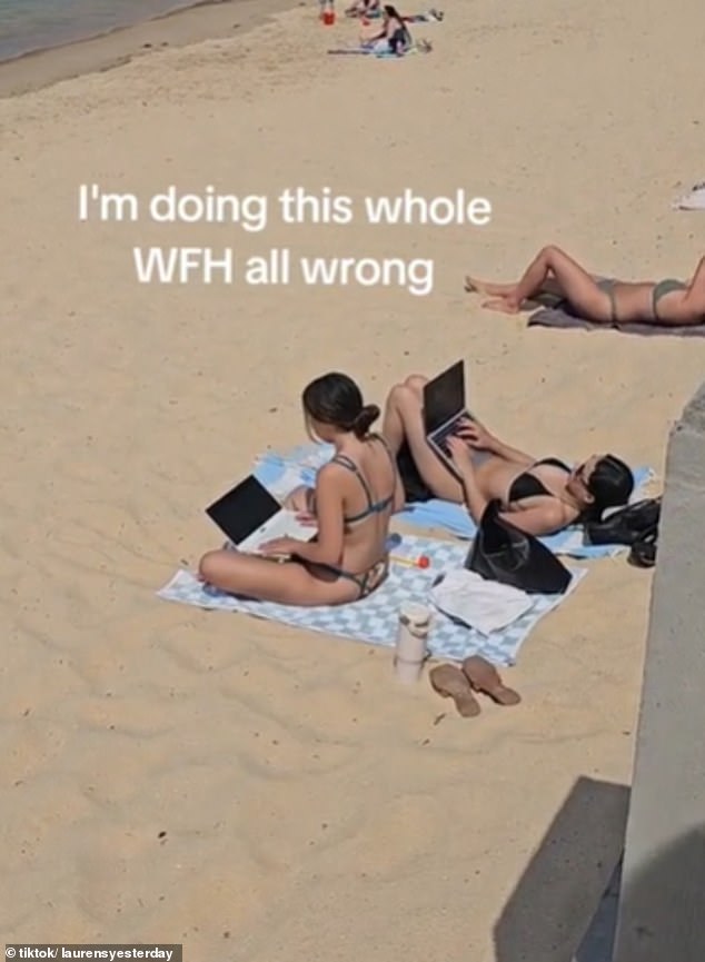 An image of two women using their laptops at North Sydney's Balmoral Beach (pictured) on a sunny Friday has sparked a furious debate over WFH privileges