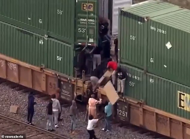 On Friday, thieves swarmed the Union Pacific train and stole several boxes of items before officers arrived