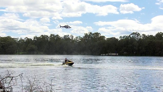 A massive rescue operation is underway at Chipping Norton Lakes in Sydney's south-west for two children who were seen in the water with a woman at 10.25am on Saturday.