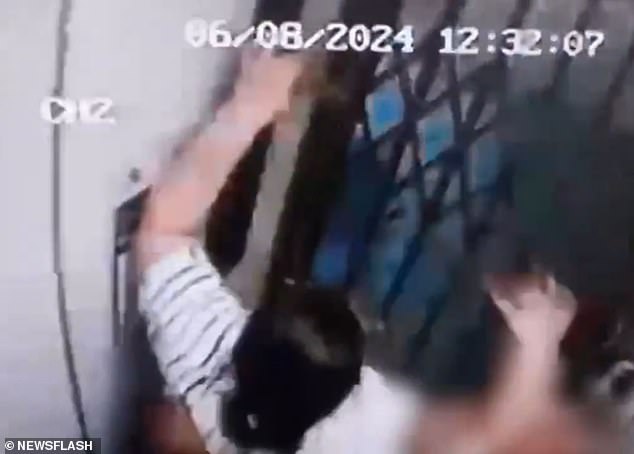 The clip, recorded on security cameras in a smart apartment building in Sao Paulo, Brazil, shows victim Adriana Maria de Jesus, 45, on her way to work