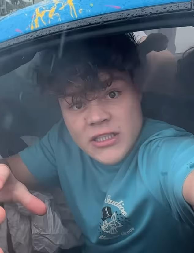 Jack Doherty, 20, crashed his $300,000 McLaren supercar on a wet Miami highway while live streaming to 185,000 fans on Kick (photo of Jack in his car after the accident)