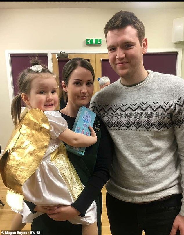 Sophia Goss, from Lenwade, Norfolk, pictured with her father Lewis and mother Megan, started pulling out her hair and chewing it when she was 18 months old as a 'soothing' technique to help her fall asleep