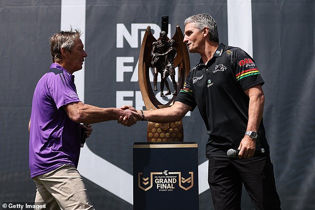 Rival coaches Craig Bellamy and Ivan Cleary shake hands before the Provan-Summons Trophy goes to the winner