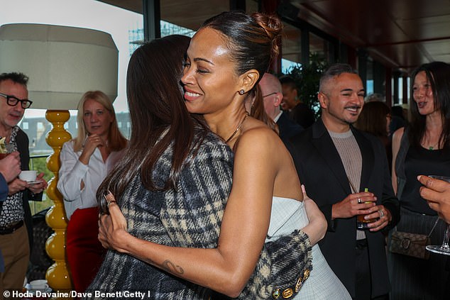 Zoe and Selena were all smiles as they hugged each other at the event