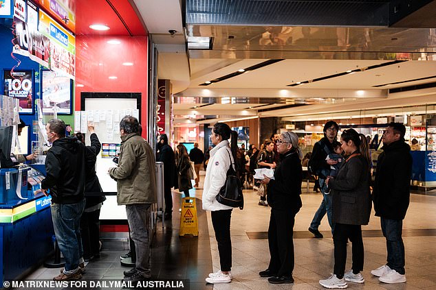 The Powerball has risen to $100 million and is the sixth largest in Australian lotto history (photo, Lotto ticket queues in Parramatta, western Sydney)