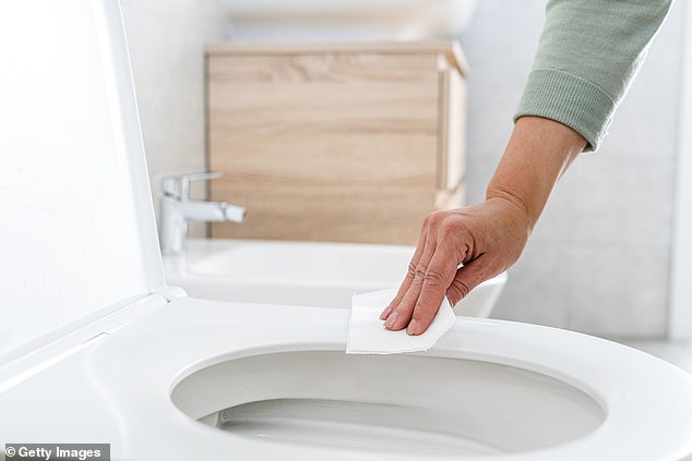 Clean all bathroom surfaces regularly with disinfectant to avoid contaminating yourself