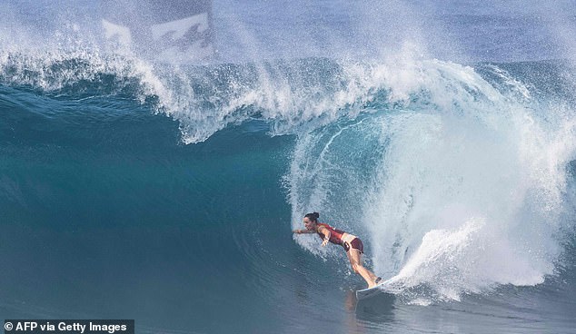 Larry didn't go to Britain. He decided to use his money to buy a ticket to Hawaii, where he came into contact with the global surfing community, from disgruntled viscounts, drug addicts, misfits and refugees like himself. Pictured: Tyler Wright of Australia competing in the Banzai Pipeline in Hawaii