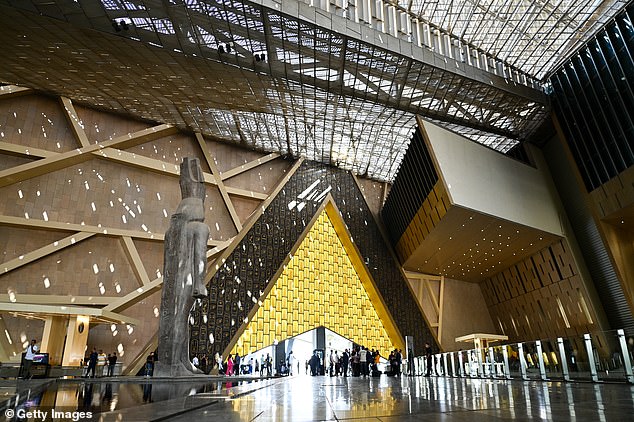 Visitors can marvel at the world's only hanging obelisk, view the treasures of Queen Hetepheres and admire the 11-meter-high statue of Ramses II that greets tourists in the museum's cavernous Great Hall (above)