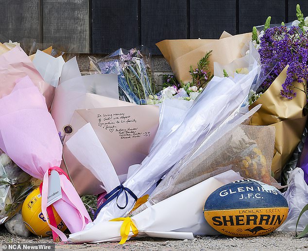 Flowers, messages and a football were left outside Auburn South Primary School in Hawthorn East on Wednesday