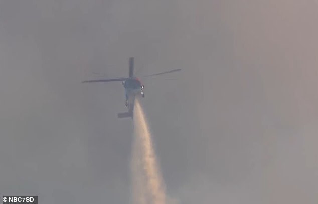 Crews from multiple agencies were deployed to control the fire, including helicopter units that dropped water and fire retardant material on the inferno from above.