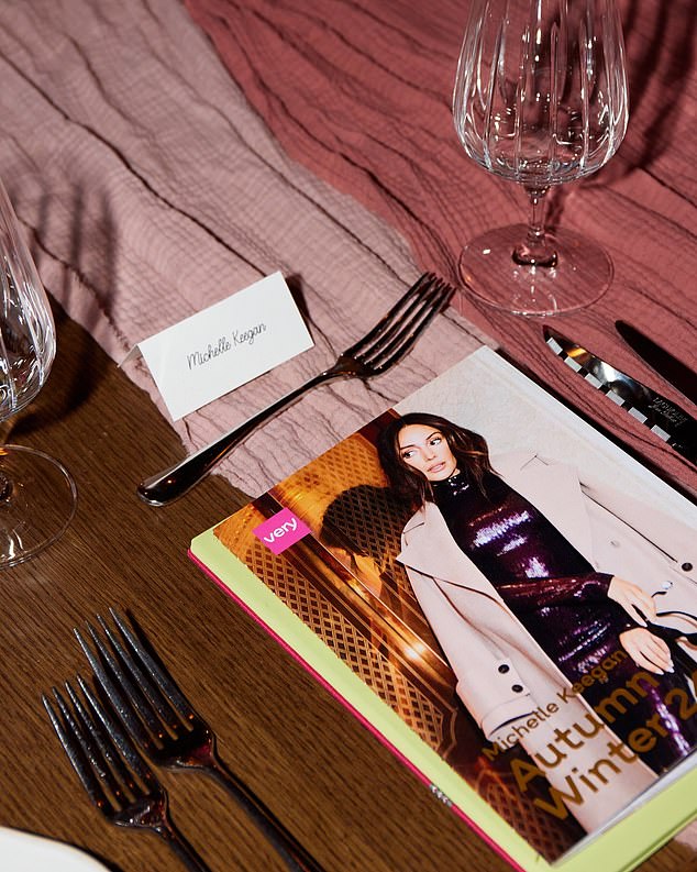 Each guest who attended the glamorous event had their own name card on the table and received a bouquet of red and pink followers and a catalog of her new collection