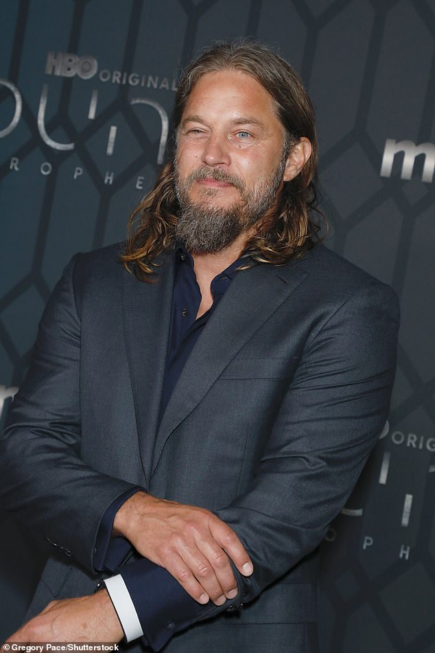 The Viking star's outfit looked sharp in a gray suit and was complemented by his shaggy salt-and-pepper beard and a longer goatee that highlighted his rugged facial features.