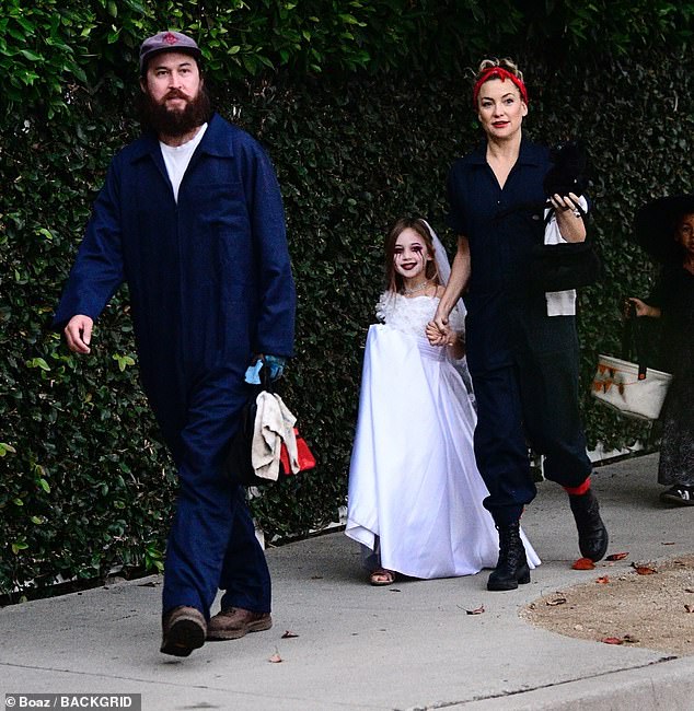 Hudson's fiancé, Danny Fujikawa, 38, accompanied mother and daughter on their trek for sweet treats, wearing denim overalls, a white T-shirt and brown boots