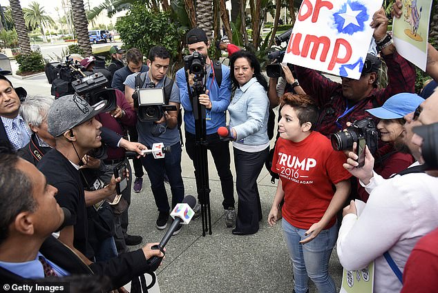 Young Latinos are expected to have a strong influence on the current election cycle, with 17.5 million people expected to vote on Tuesday. The October survey found that young Latino men are the most likely to reject the term. Pictured: Protesters and supporters faced off outside the Anaheim Convention Center in 2016