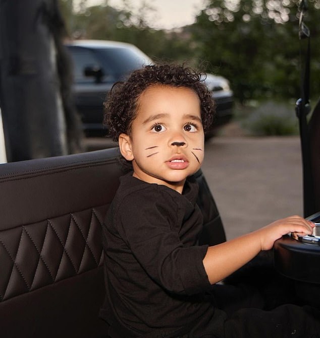 Here the boy is seen in the cart with black seats