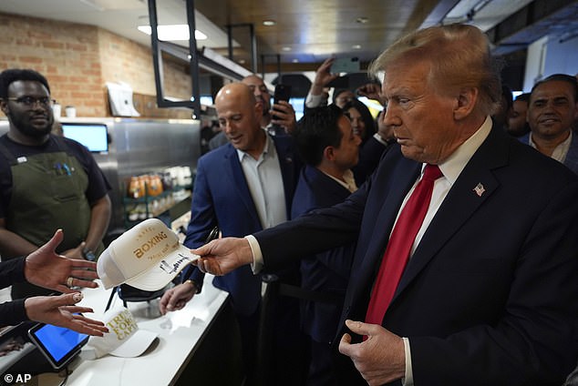 Trump signed a hat and posed for selfies during the visit