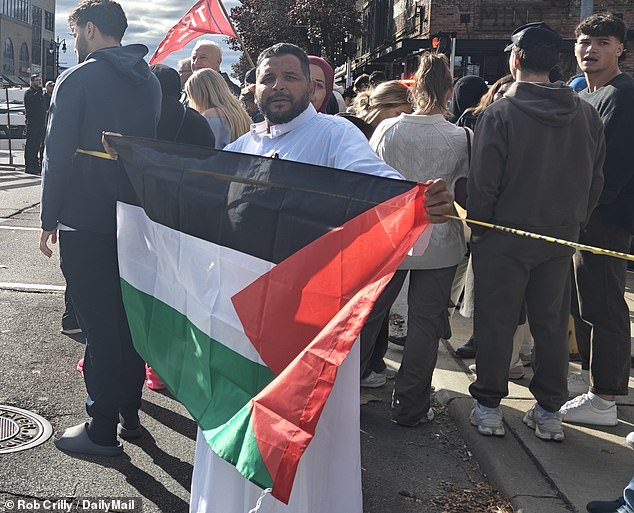 Fawzy Mohamad unfurled a Palestinian flag as part of a protest outside Trump's visit