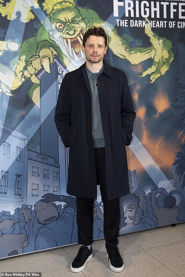 Director Sam cut a casual figure in a dark ensemble and wool coat