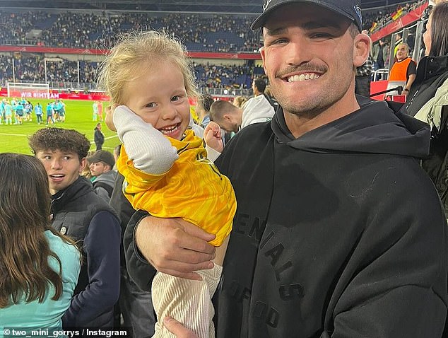 The halfback also attended a Matildas match (pictured, with Katrina Gorry's daughter Harper)