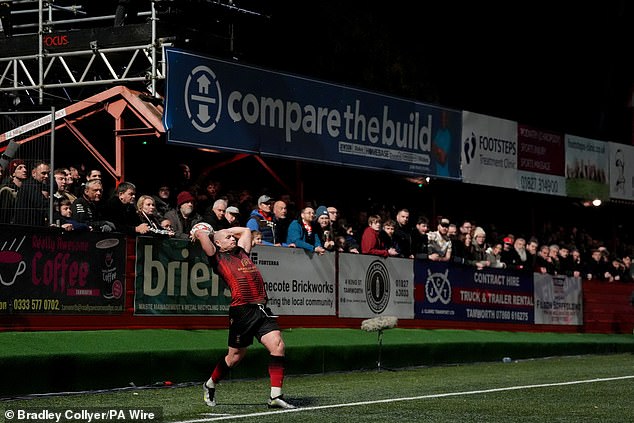 Huddersfield were undone by a 35-yard long throw taken by Tamworth midfielder Tom Tonks