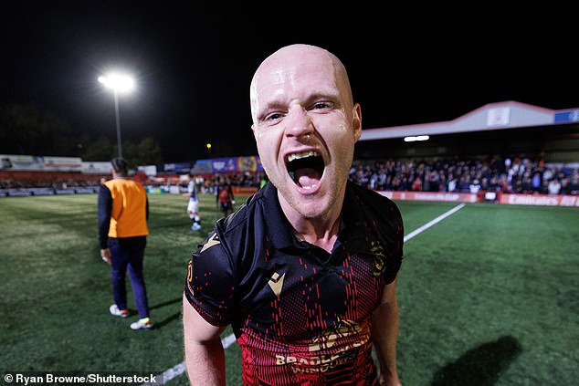 Thirty-three-year-old Tanks pictured celebrating on the pitch after the final whistle