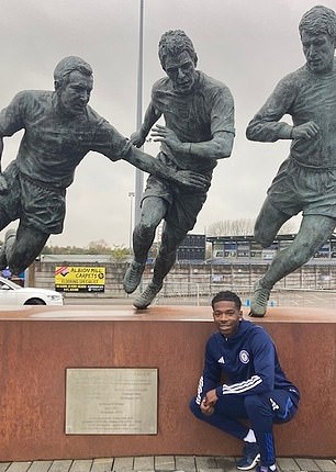 His Curzon Ashton plays football next to a statue of English legend Sir Geoff Hurst from 1966