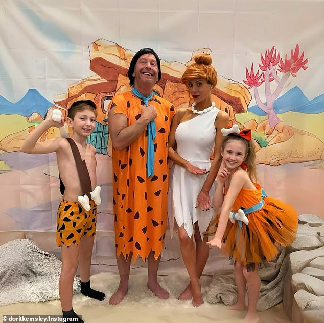 She shared photos of herself, son Jagger, daughter Phoenix and estranged husband Paul dressed as The Flintstones for Halloween