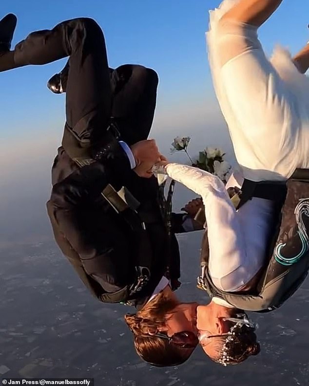 The couple were seen hugging in the air as they plummeted to earth from more than 10,000 feet