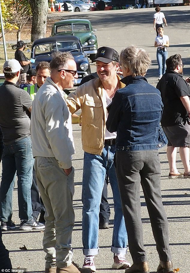 Writer and director Scott Cooper (center) was also there to help welcome the Boss to the set of the biopic, which stars The Bear's Jeremy Allen White as a Nebraska-era Springsteen.