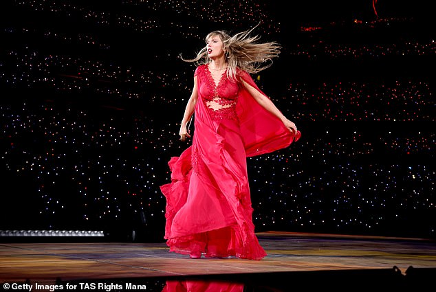 For the Folklore and Evermore portion of her concert, she looked striking in her scarlet dress with the flowing cape that fell around her.