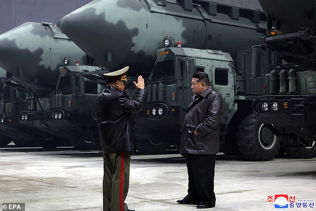 A photo released by the official North Korean Central News Agency (KCNA) on October 23, 2024 shows North Korean leader Kim Jong Un (R) inspecting strategic missile bases