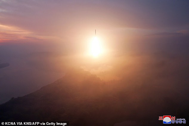 This photo, released by North Korea's official Korean Central News Agency (KCNA) on October 31, shows the launch of an intercontinental ballistic missile (ICBM) during a test firing