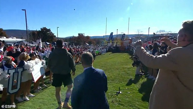 Kelce, wearing Timberland boots, kicked his first attempt far left in front of hundreds of people