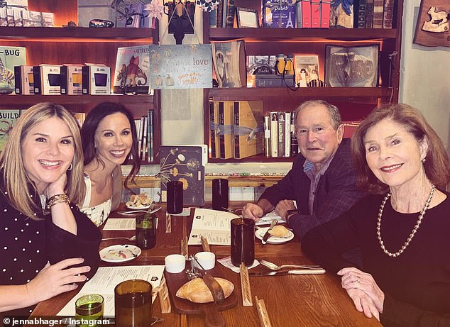 The former president is seen here next to his wife Laura and daughters Jenna and Barbara