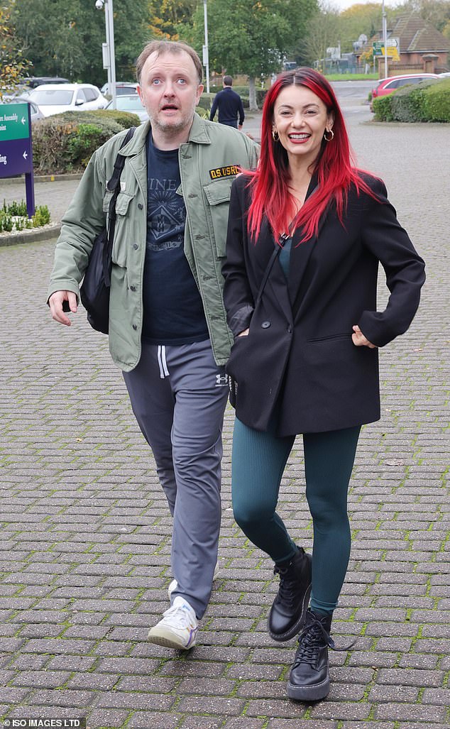 Comedian Chris McCausland, 47, and his professional dance partner Dianne Buswell, 35, appeared in good spirits as they walked side by side