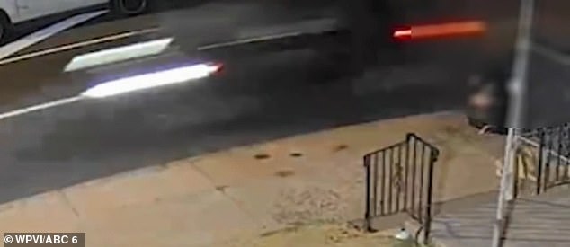 The terrifying surveillance footage shows what police describe as a dark-colored SUV driving away from the scene at high speed