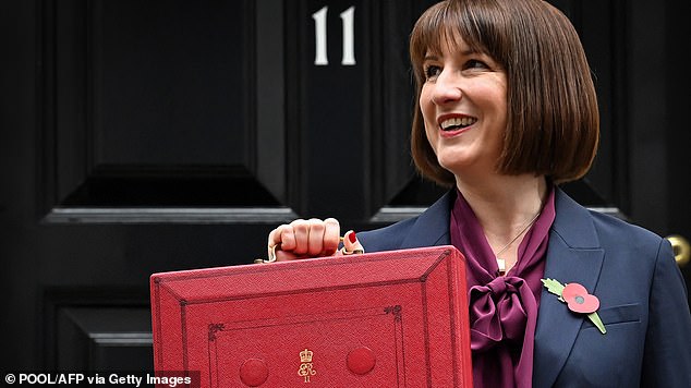 British Chancellor of the Exchequer Rachel Reeves poses with the red Budget Box as she leaves 11 Downing Street, central London, on October 30, 2024