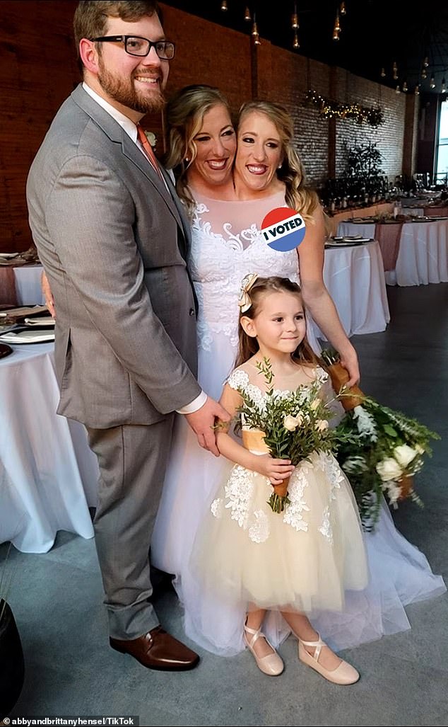 Another photo showed Isabella, dressed in flower girl outfits and holding a bouquet, posing with them