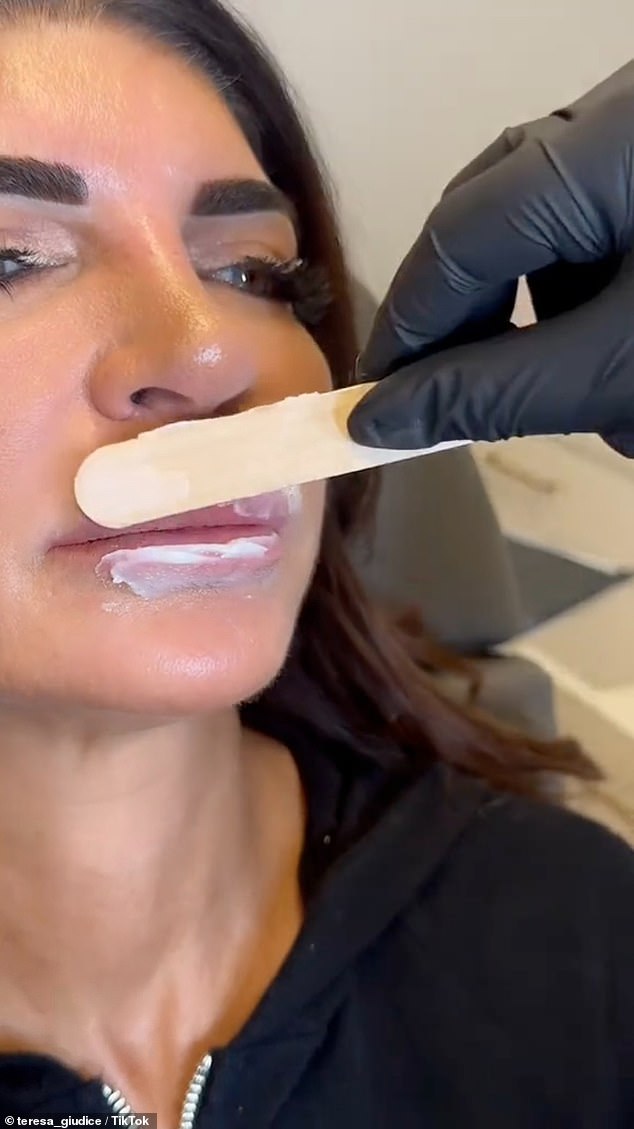 She sat on the treatment table and as fans watched as her lips were prepared with a numbing cream and injected with special enzymes that dissolve hyaluronic acids