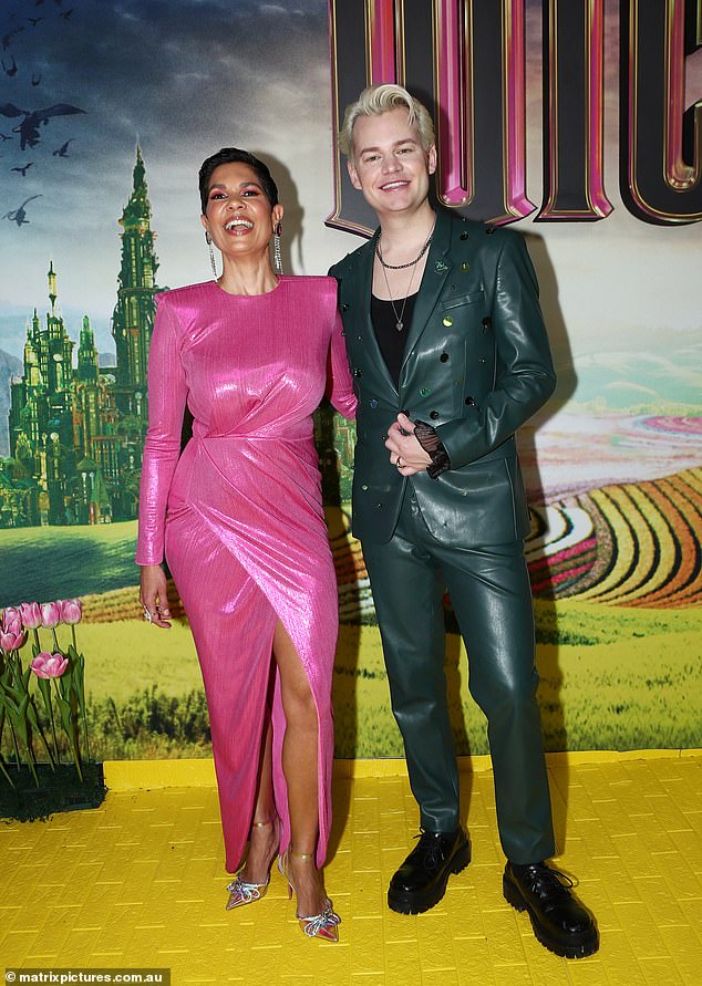 Channel 10 presenter Narelda Jacobs dazzled in a sequin cut-out dress as she posed for a photo alongside Joel Creasey