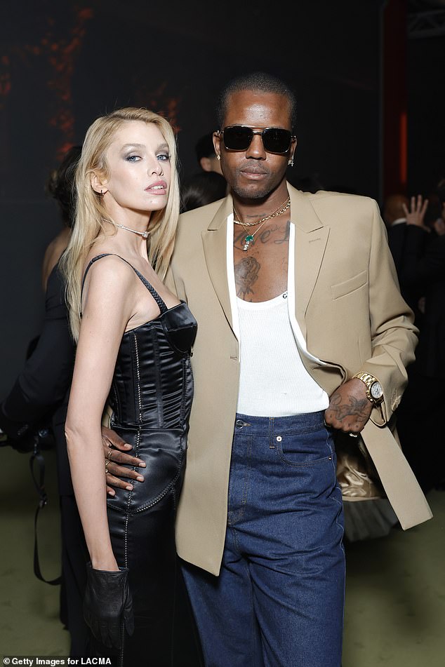 Stella Maxwell turned heads in a satin figure-hugging dress as she posed alongside former TOWIE star Vas J Morgan