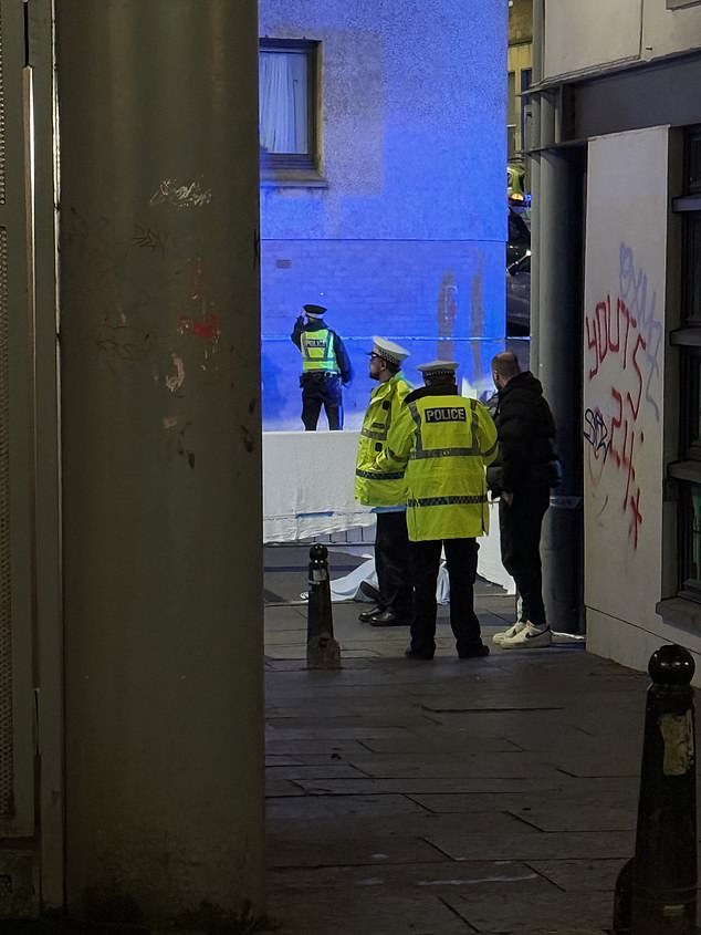 A photo taken by witnesses shows officers standing at the scene, which was recorded on tape