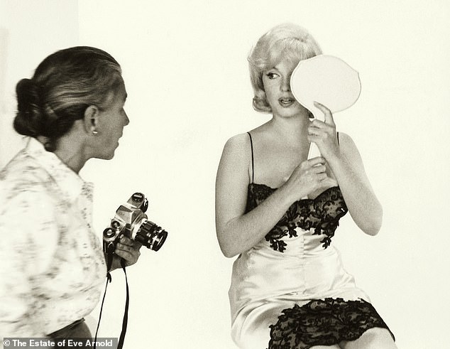 He claimed she was much more 'vulnerable' and 'self-conscious' than she appeared in public. Eve is seen with Marilyn during a photo shoot