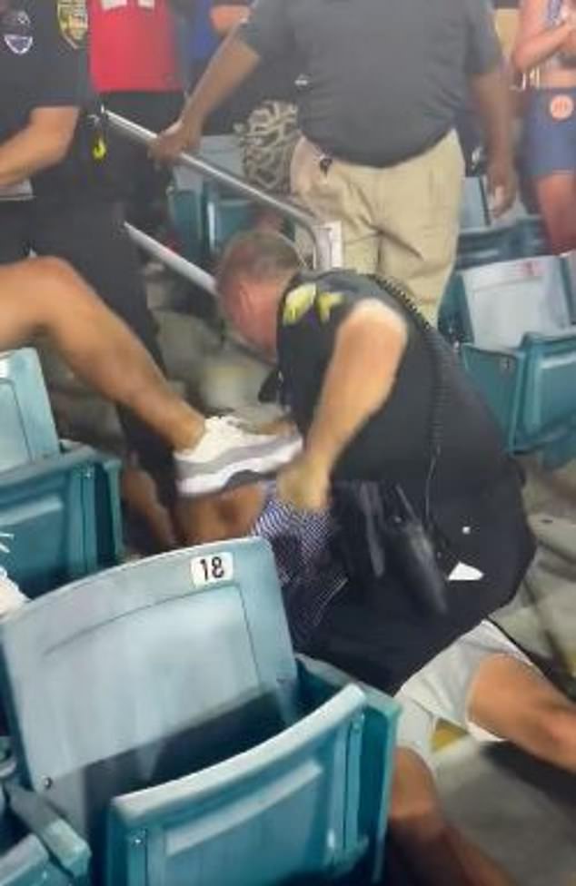 Another officer had tied a second fan to the stairs while hitting him repeatedly